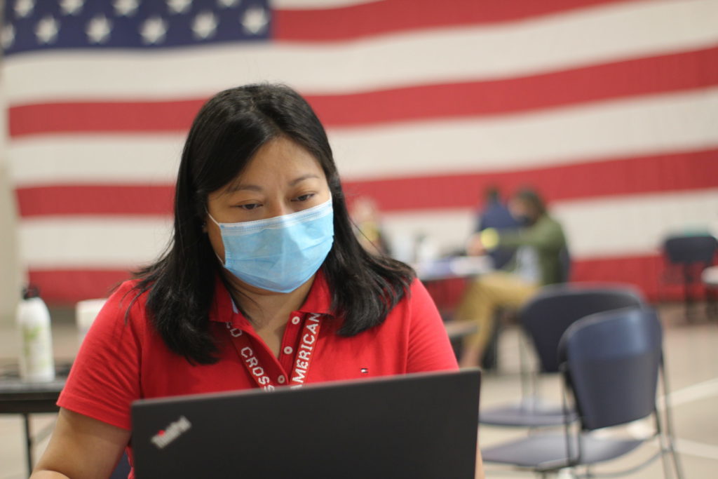 Jenny Legaspi of the Red Cross working at the Oregon Emergency Coordination Center in Salem, OR. Photo by Axl David/American Red Cross.