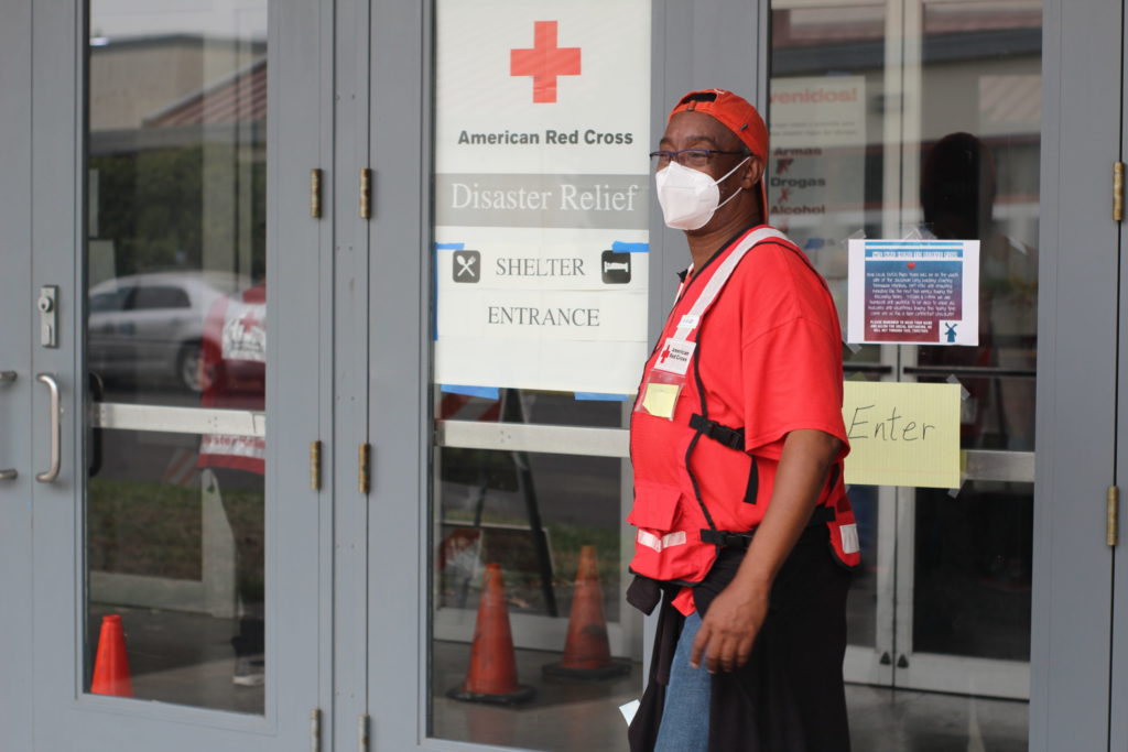 American Red Cross volunteer Michael Watkins welcomes those visiting the Red Cross shelter at the Oregon State Fairgrounds in Salem, Oregon on Tuesday, Sept. 15, 2020. Photo by Axl David/American Red Cross.