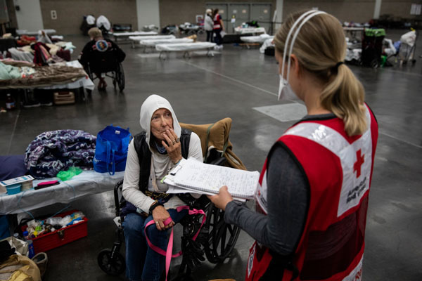 Julia M. Taylor speaks to an American Red Cross nurse at an American Red Cross shelter in Portland, OR on Monday, September 14, 2020. Julia was evacuated from her home as wildfires burned throughout the state.