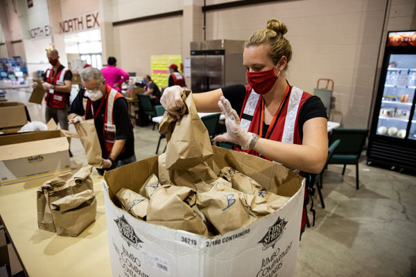 American Red Cross volunteers pack snack bags on Sept. 15, 2020 for evacuees staying at an American Red Cross shelter, in Salem, OR. Photo by Scott Dalton/American Red Cross.